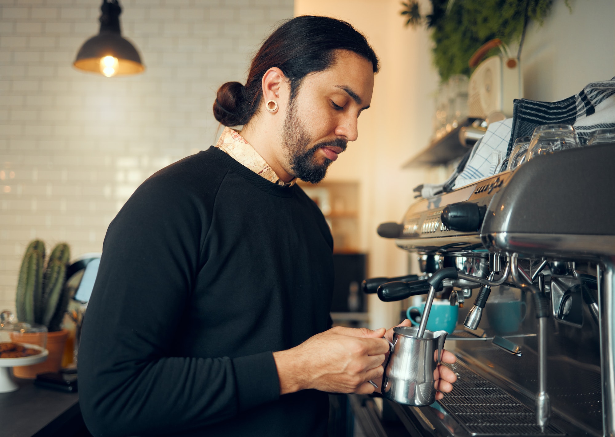 Coffee shop, cafe barista and kitchen machine work for morning espresso in a restaurant. Waiter, mi